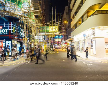 HONG KONG - OCT 22: Tsim Sha Tsui at night on October 2 2015 in Hong Kong. Tsim Sha Tsui is a major tourist hub in metropolitan Hong Kong with many high-end shops and restaurants
