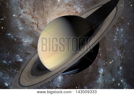 Solar System - Saturn. It is the sixth planet from the Sun and the second-largest in the Solar System. It is a gas giant planet and has a ring system. Elements of this image furnished by NASA.