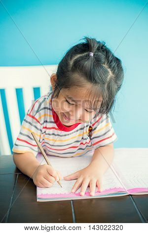 asian young girl children happy doing her homework people, family concept