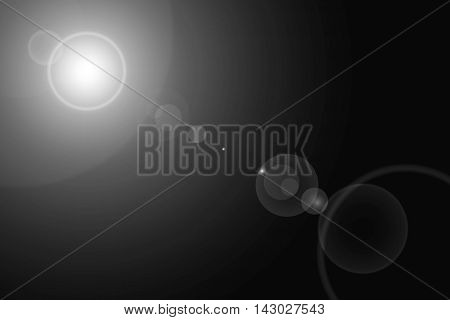 Digital lens flare in black background horizontal frame warm and abstract background