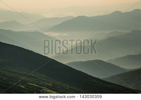 Hills during sunrise in mountain valley. Beautisul natural landscape