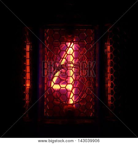 The real Nixie tube indicator of the numbers of retro style. Indicator glow with a magical purple fringing. Digit 4