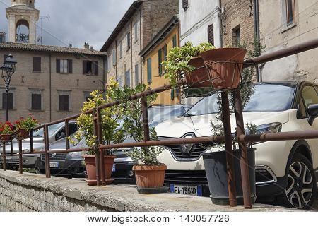 Urbania, Italy - August, 1, 2016: car parking in Urbania, Italy 