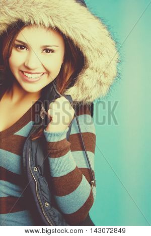 Smiling woman wearing winter clothing