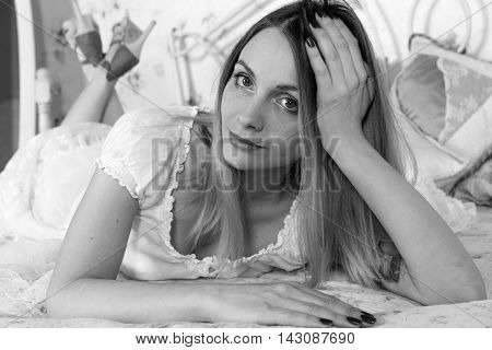 Black and white portrait pretty girl on bed
