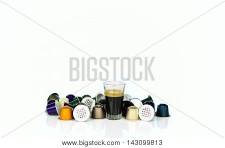 Single-serve espresso shot coffee capsules on white background