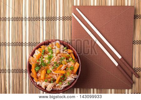 Top View On A Portion Of Rice Vermicelli Hu-teu In A Small Brown Wooden Bowl