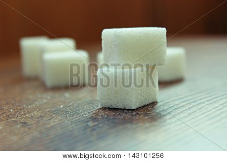Sugar cubes close up view. Selective focus.