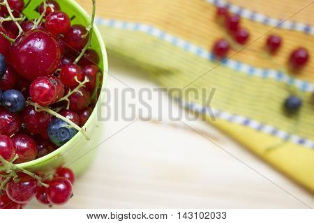 Fresh summer berries top view with a blurry background
