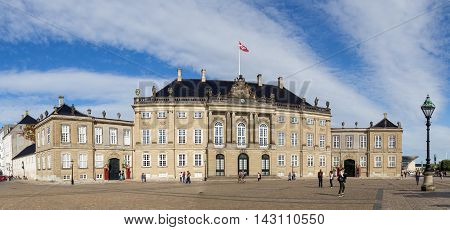 Copenhagen, Denmark - August 18, 2016: Tourists in front of the royal palace Amalienborg