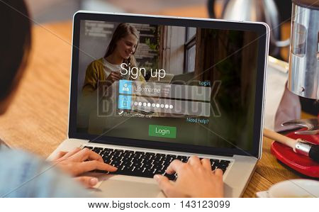 signup screen with blonde girl and pad against woman using laptop at office
