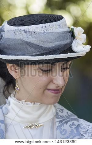 CAGLIARI, ITALY - June 1, 2014: Sunday at La Grande Jatte public gardens - Sardinia - portrait of a beautiful woman in Victorian costumes