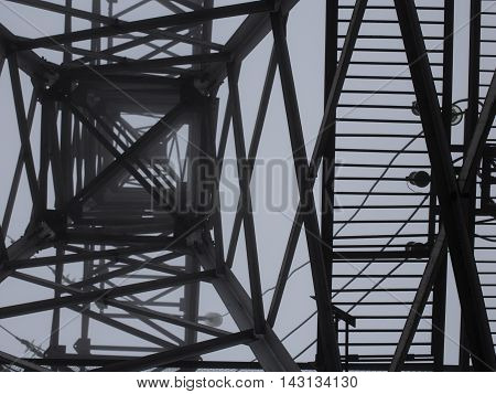 transmission tower silhouette in mist white background