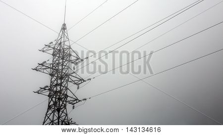 transmission tower silhouette in mist white background