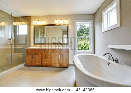 Bathroon  With Vanity Cabinet And Shower Area With Glass Doors