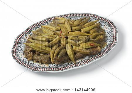 Traditional  Moroccan dish with meat and okra, Mloukhiya on white background
