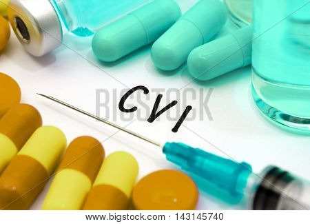 CVI (chronic venous insufficiency) - diagnosis written on a white piece of paper. Syringe and vaccine with drugs.