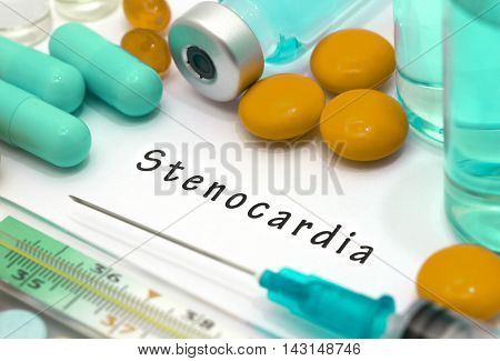Stenocardia - diagnosis written on a white piece of paper. Syringe and vaccine with drugs.