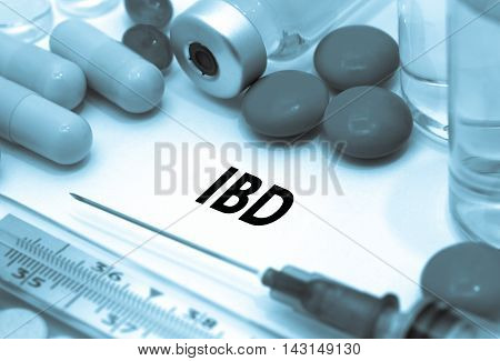 IBD (inflammatory bowel disease). Treatment and prevention of disease. Syringe and vaccine. Medical concept. Selective focus