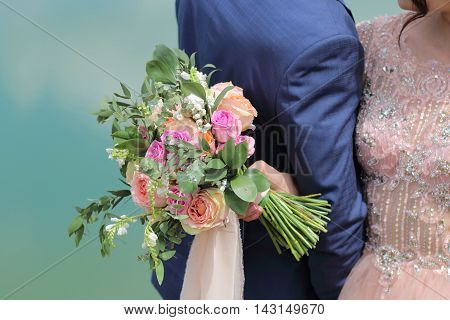Beautiful Bridal Bouquet In Hands Of The Bride. Wedding Bouquet Of Peach Roses By David Austin,  Sin