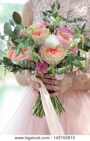 Beautiful Bridal Bouquet In Hands Of The Bride. Wedding Bouquet Of Peach Roses By David Austin,  Sin