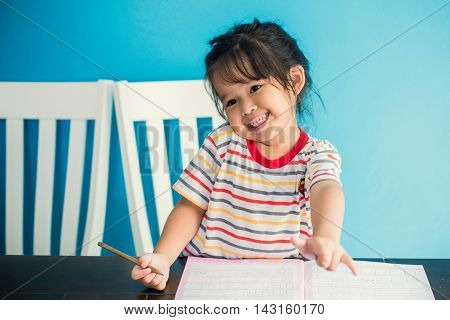 asian young girl children happy doing her homework people, family concept