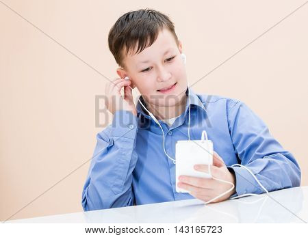 The Boy Listens To Music