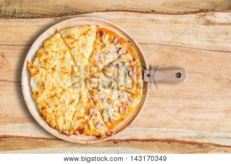 Homemede Pizza on wooden plate old wood table