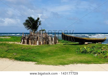 Central America Panama Traditional boat Kuna indians and homestead for animals on the San Blas archipelago