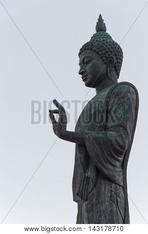 Buddha image in walking posture at Buddhamonthon (Phutthamonthon), Buddhist Park in Nakhon Pathom, Thailand