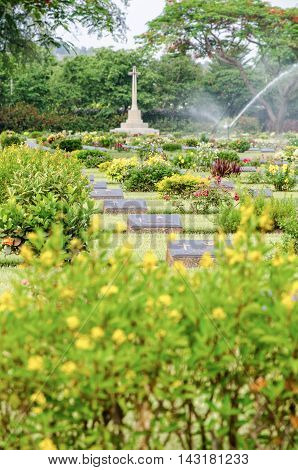 KANCHANABURI THAILAND - MAY 3 2014: Chungkai War Cemetery this is historical monuments where to respect prisoners of the World War 2 who rest in peace here MAY 3 2014 in Thailand