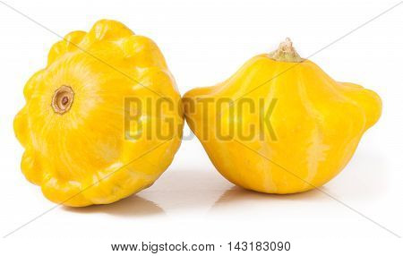 two yellow pattypan squash isolated on white background.