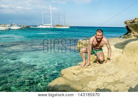 25 may 2016.Protaras.A man in shorts posing on the beautiful beach of Protaras.Cyprus.