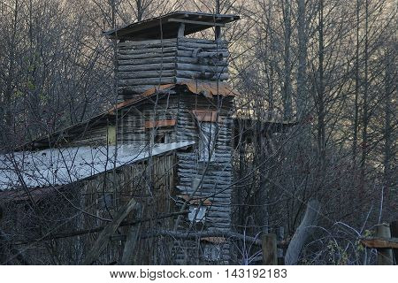 Wooden tower in the forest additional building autumn V