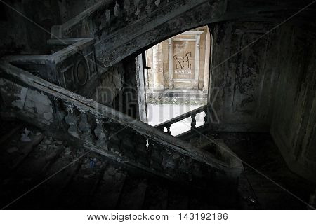 Stone staircase in an abandoned building hat V