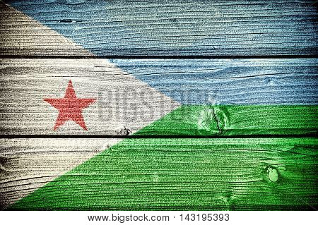 Flag of Djibouti painted on old grungy wooden background: 3d illustration