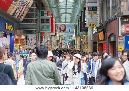OSAKA JAPAN - Apr 24 2016 : People walking in the Dotonburi Osaka. Dotonburi is one of the principal tourist destinations in Osaka Japan.