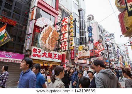 OSAKA JAPAN - Apr 24 2016 : People walking in the Dotonburi Osaka. Dotonburi is one of the principal tourist destinations in Osaka Japan.