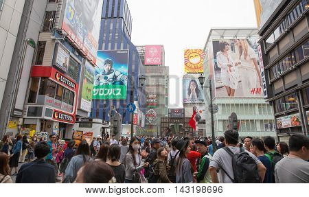 OSAKA JAPAN - Apr 24 2016 : People walking in the Dotonburi Osaka. Dotonburi is one of the principal tourist destinations in Osaka Japan.