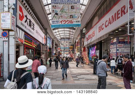 OSAKA JAPAN - Apr 24 2016 : People walking in the Dotonburi Osaka. Dotonburi is one of the principal tourist destinations in Osaka Japan.