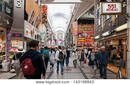 OSAKA JAPAN - Apr 24 2016 : People walking in the Dotonburi Osaka. Dotonburi is one of the principal tourist destinations in Osaka Japan.