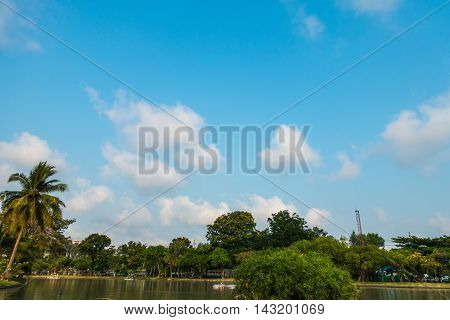 Clouds over the lake in the park.on nature background