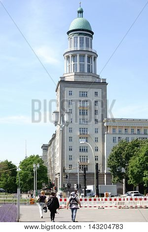 BERLIN, GERMANY - MAY 09: A tower of Frankfurter Gate in Berlin Friedrichshain with adjacent sidewalks and flower beds on May 09, 2015 in Berlin.
