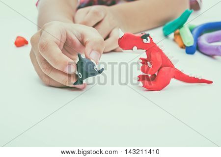 Child Molding Model Clay, On White Background. Strengthen The Imagination. Vintage Tone Effect.