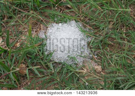 Desiccant silica gel on grass background desiccant, white, water