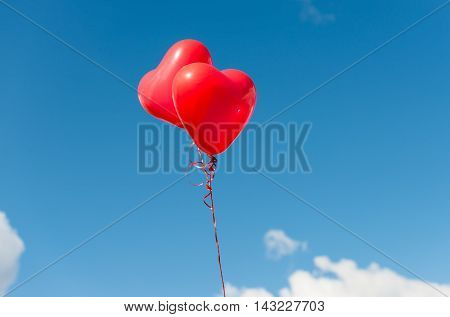 Valentine heart balloon against blue sky background