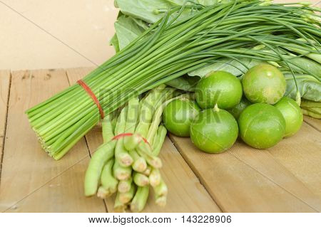 green Lime Yardlong bean Leek and kale on wood floor