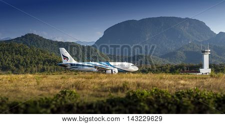 LUANG PRABANGLAO PDR. - NOVEMBER 9 2015: Bangkok Airways - HS-PPB Airbus A319 landing at Luang Prabang International Airport from Suvarnnabhumi International Airport Bangkok Thailand