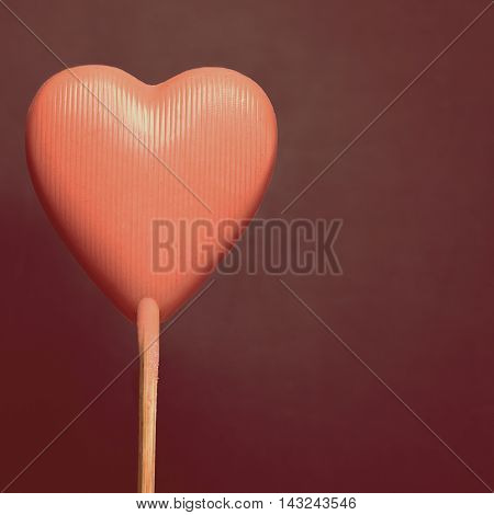 Valentines background with tasty pink chocolate heart