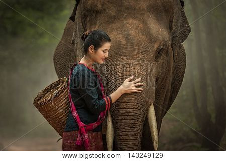 Closeup portrait of a beautiful girl with elephant.